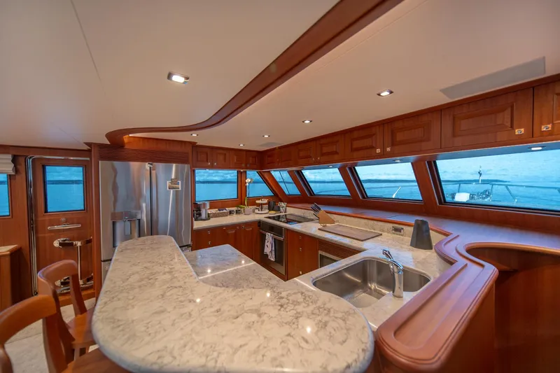 Slide: The Image of Luxurious kitchen interior of 2022 Hampton Endurance 750 LRC yacht with ocean view. - 14