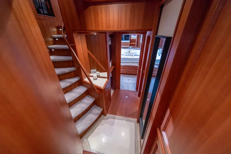 Slide: The Image of Luxurious wooden interior of 2022 Hampton Endurance 750 LRC yacht with staircase and hallway. - 17