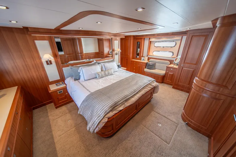 Slide: The Image of Luxurious bedroom interior of 2022 Hampton Endurance 750 LRC yacht with elegant wood finishes. - 19
