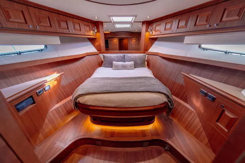 Slide: The Image of Luxurious cabin interior of 2022 Hampton Endurance 750 LRC yacht with elegant wood finish. - 29