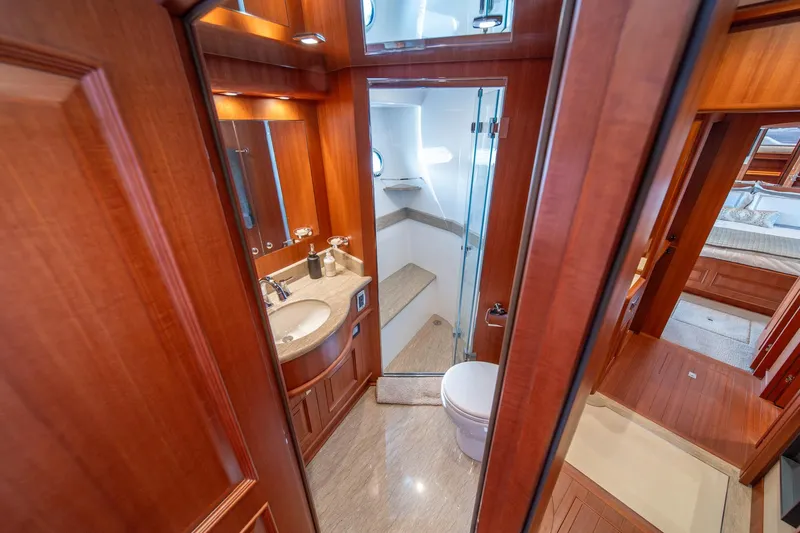 Slide: The Image of Luxurious bathroom in 2022 Hampton Endurance 750 LRC yacht with wood accents and modern fixtures. - 31