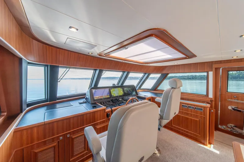 Slide: The Image of Luxurious helm of 2022 Hampton Endurance 750 LRC yacht with panoramic windows. - 34