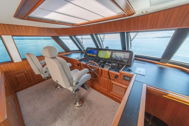 Slide: The Image of Pilothouse interior of 2022 Hampton Endurance 750 LRC yacht with navigation equipment. - 35