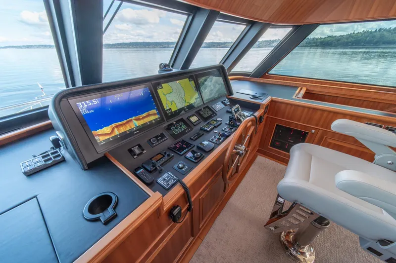 Slide: The Image of Helm of 2022 Hampton Endurance 750 LRC yacht with advanced navigation systems. - 38