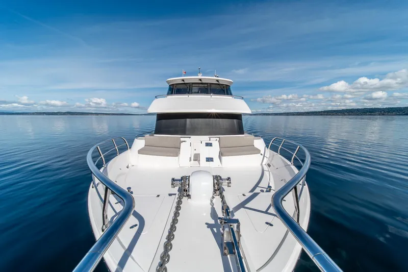 Slide: The Image of 2022 Hampton Endurance 750 LRC yacht on calm water under blue sky. - 42