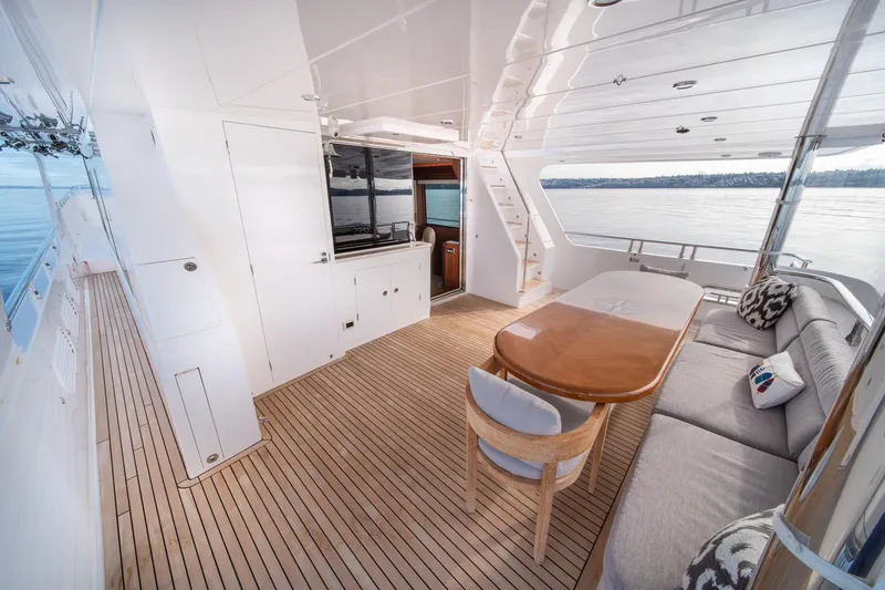 Slide: The Image of Luxurious 2022 Hampton Endurance 750 LRC yacht interior with elegant seating and dining area. - 43