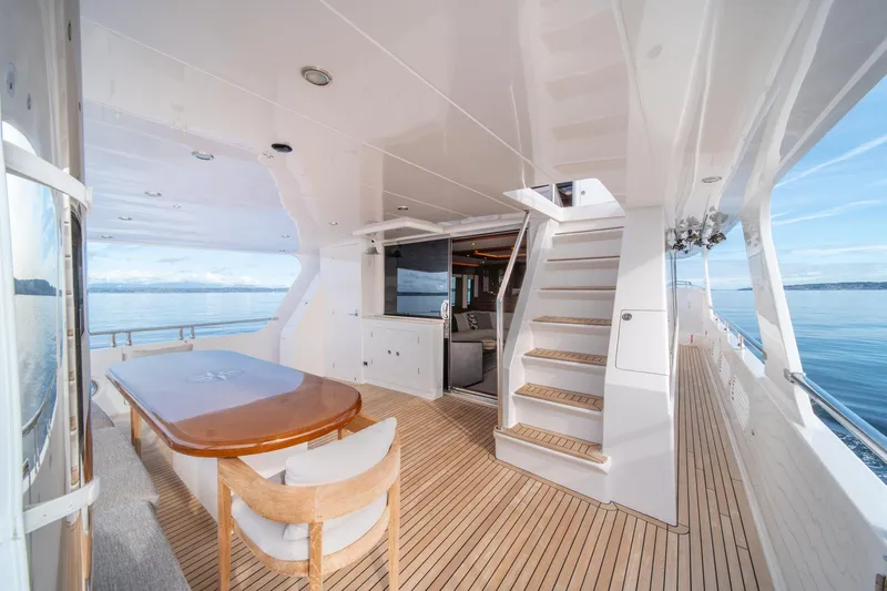 Slide: The Image of Luxurious 2022 Hampton Endurance 750 LRC yacht deck with dining area and ocean view. - 45