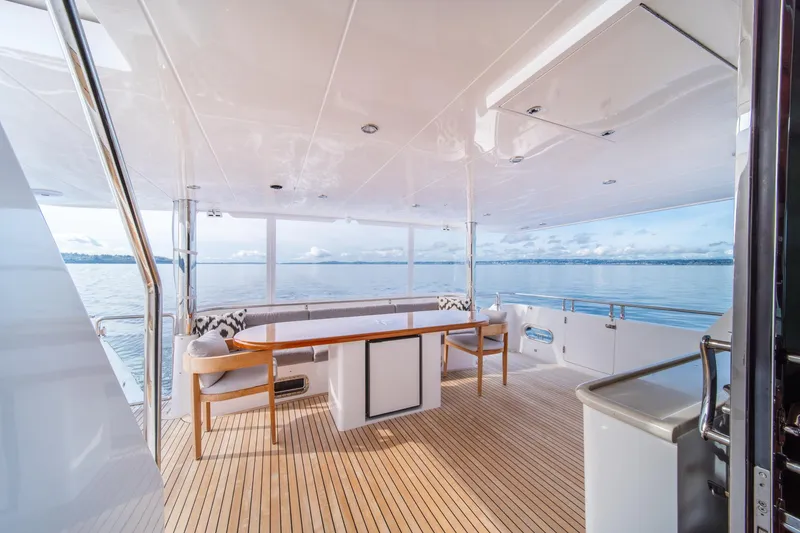 Slide: The Image of Luxurious 2022 Hampton Endurance 750 LRC yacht deck with ocean view and elegant seating. - 46