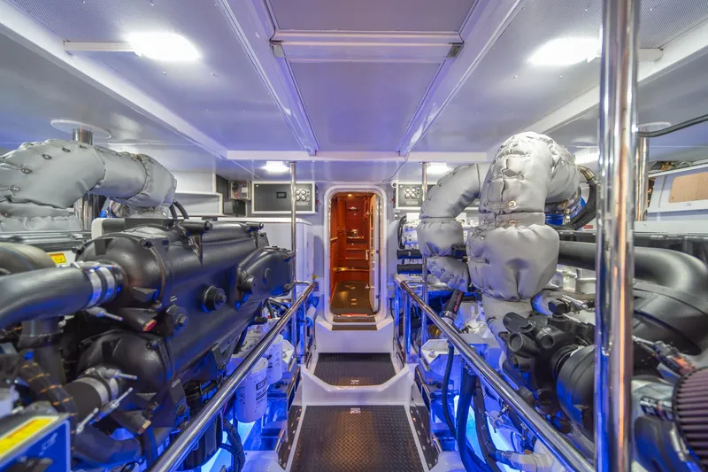 Slide: The Image of Engine room of 2022 Hampton Endurance 750 LRC yacht, featuring advanced machinery and lighting. - 48