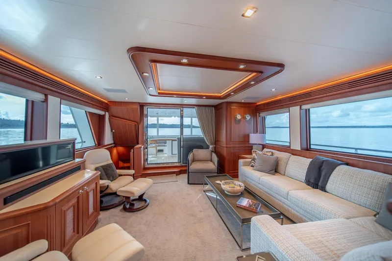Slide: The Image of Luxurious interior of 2022 Hampton Endurance 750 LRC yacht with elegant furnishings and panoramic windows. - 5