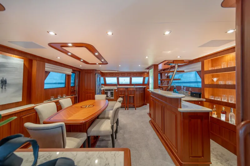 Slide: The Image of Luxurious interior of 2022 Hampton Endurance 750 LRC yacht with elegant dining area and bar. - 8