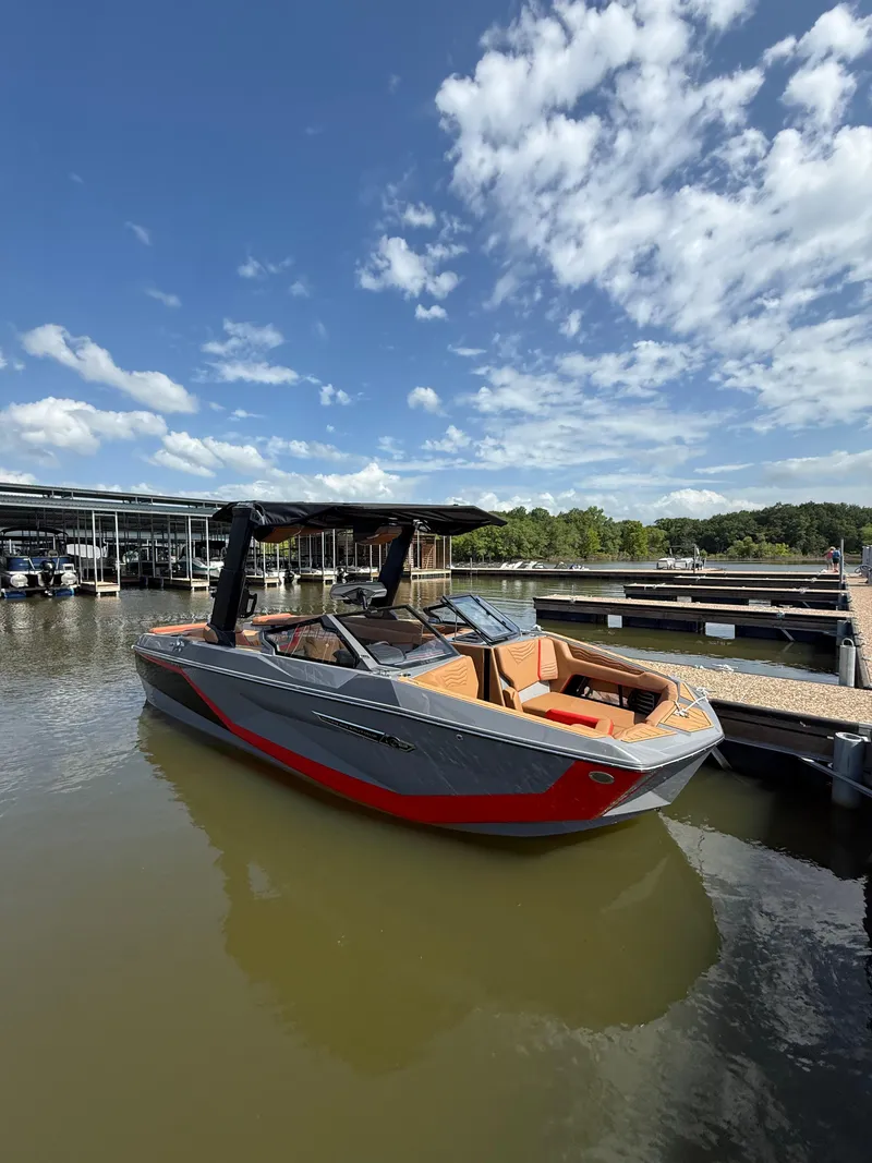 The Image of 2025 Nautique Super Air Nautique G23 boat docked on a sunny day. - 0