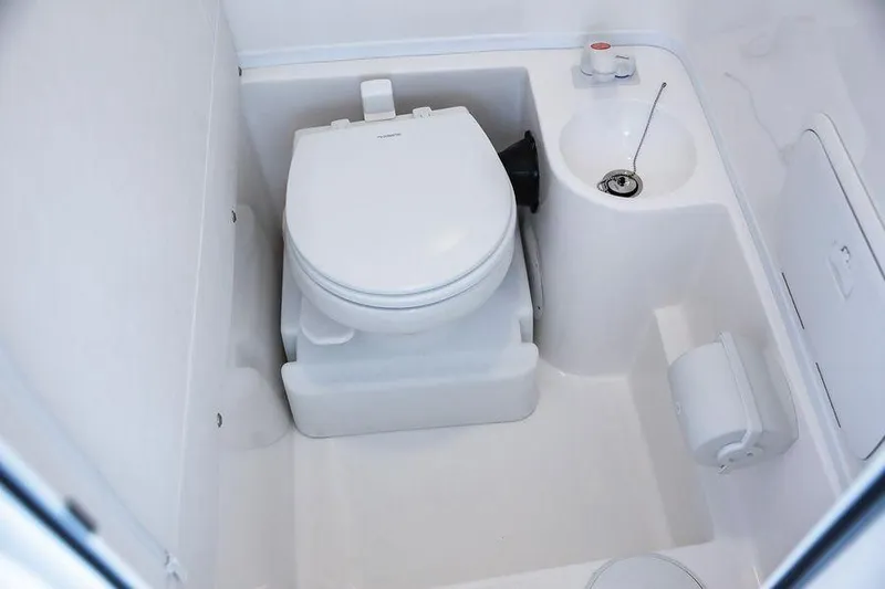 Slide: The Image of 2024 Fountain 34 CC boat interior bathroom with toilet and sink. - 10