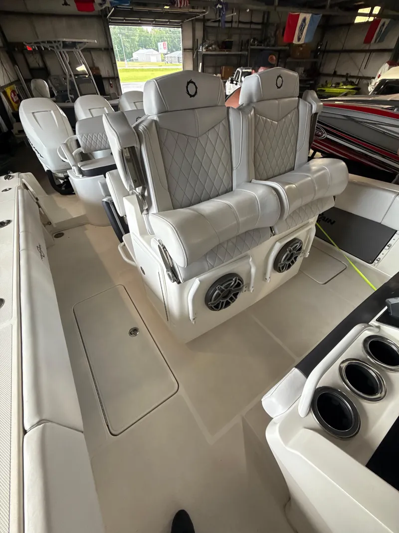 Slide: The Image of 2023 Fountain 34 CC boat interior with luxurious seating and built-in speakers. - 17