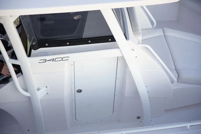 Slide: The Image of 2024 Fountain 34 CC boat interior with sleek white design and seating area. - 3