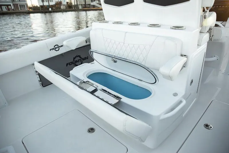 Slide: The Image of 2024 Fountain 34 CC boat interior with seating and storage compartments. - 5
