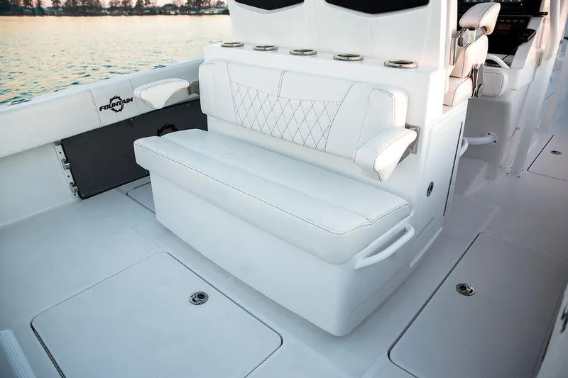 Slide: The Image of 2024 Fountain 34 CC boat interior with white seating and armrests. - 6