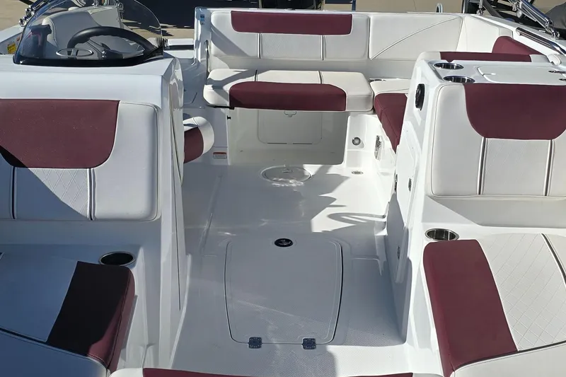 Slide: The Image of 2020 Tahoe 1950 boat interior with white and maroon seating, spacious layout. - 3