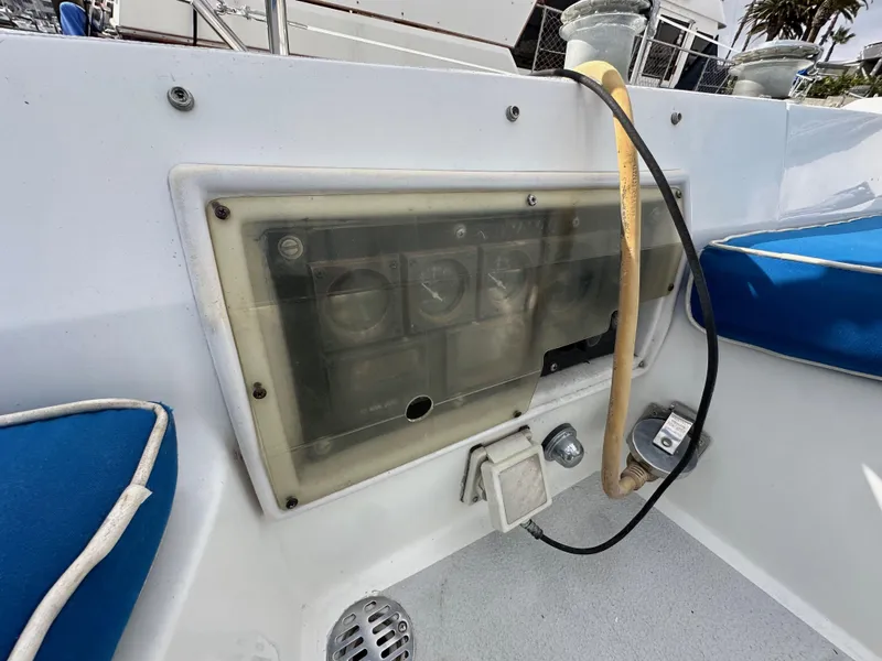 Slide: The Image of Control panel of 1987 Hunter Legend 45 sailboat with blue seating. - 21
