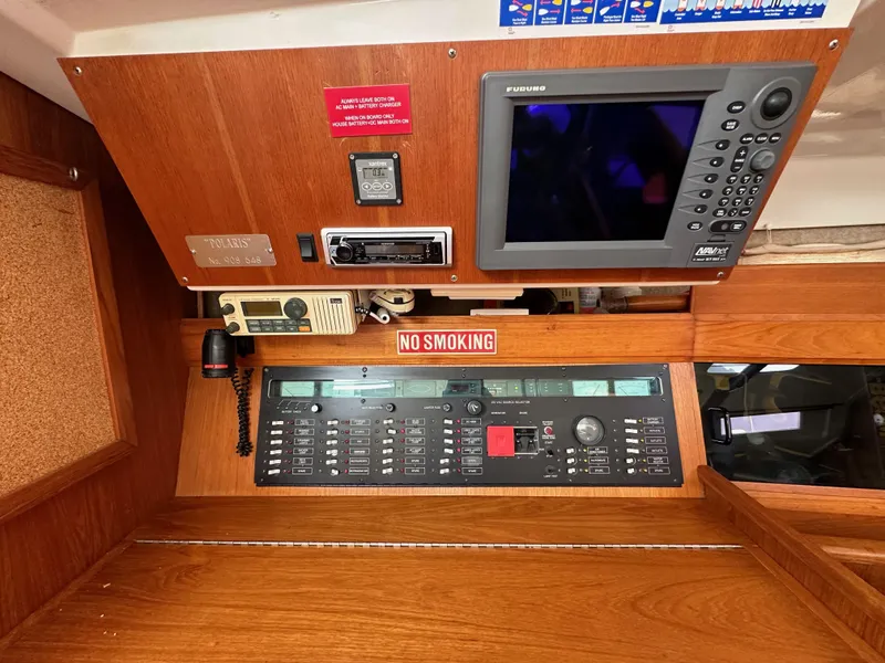 Slide: The Image of Control panel of 1987 Hunter Legend 45 sailboat with navigation equipment and "No Smoking" sign. - 39