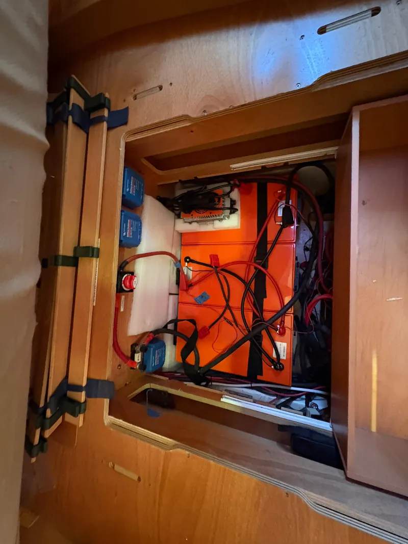 Slide: The Image of Lagoon 400 2012 yacht interior showing battery compartment and wiring setup. - 20