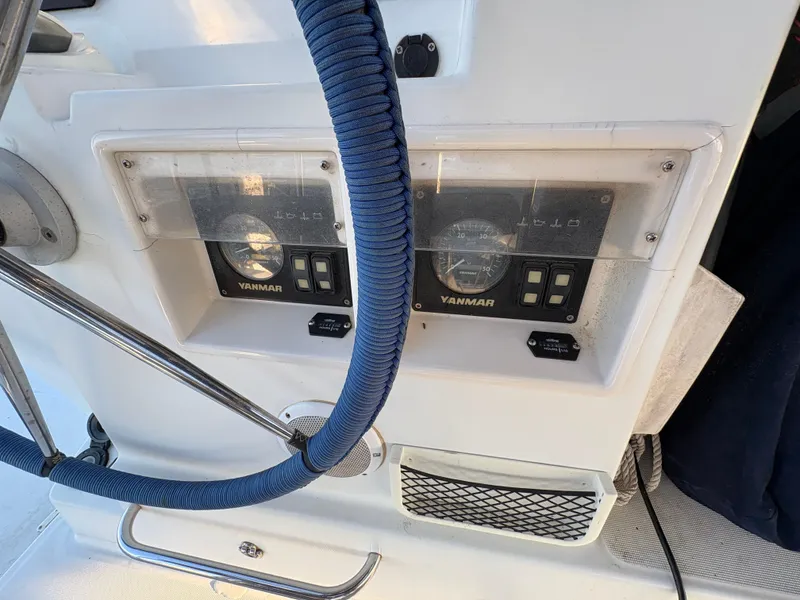 Slide: The Image of Control panel of a 2012 Lagoon 400 catamaran with Yanmar engine displays. - 24