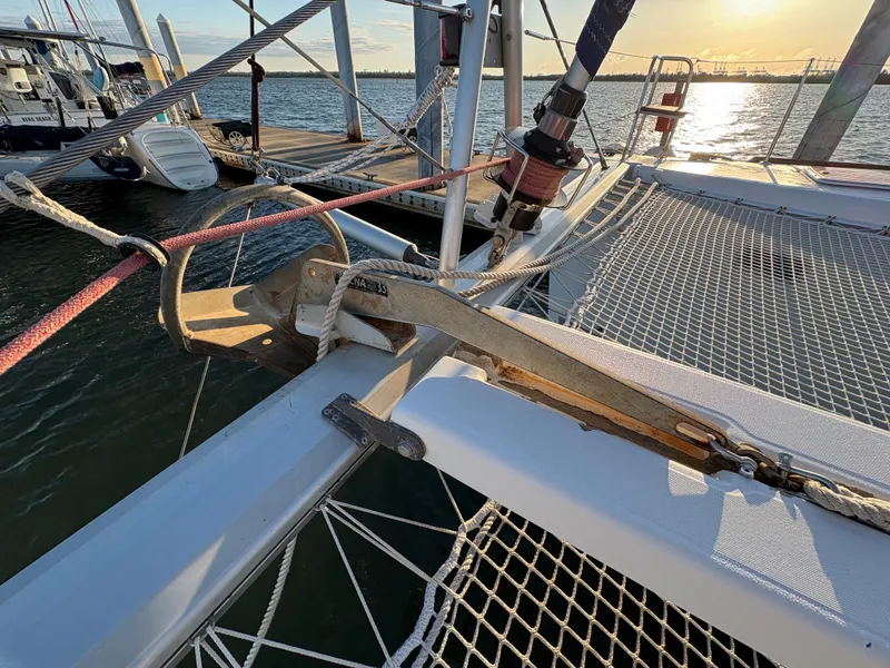 Slide: The Image of Lagoon 400 catamaran deck detail with anchor, 2012 model, docked at sunset. - 31