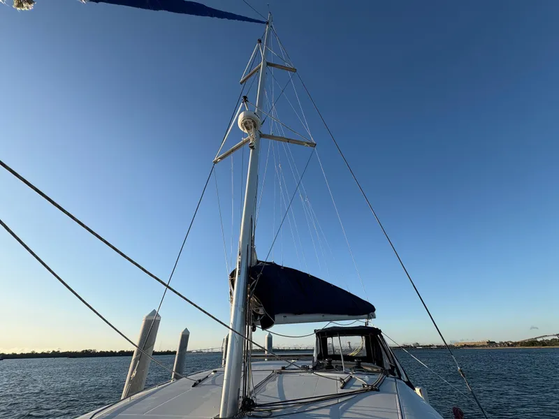 Slide: The Image of 2012 Lagoon 400 sailboat on calm water under clear blue sky. - 34