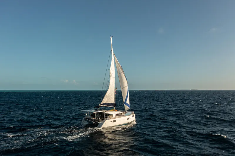 Slide: The Image of Sailing Lagoon 400 catamaran on open sea under clear blue sky, 2012 model. - 48