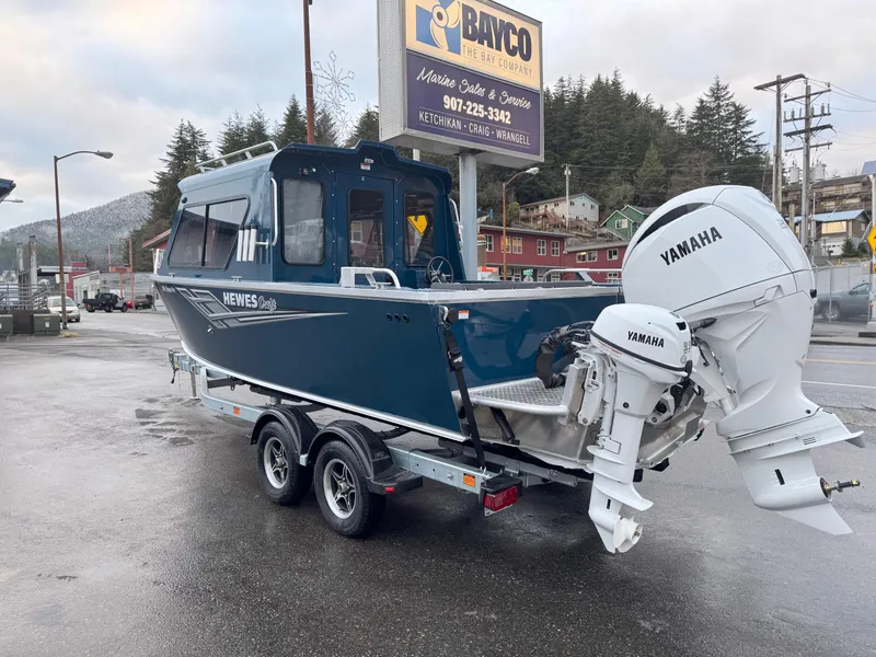 Slide: The Image of 2025 Hewescraft 220 Ocean Pro boat with Yamaha engine on trailer in parking lot. - 3