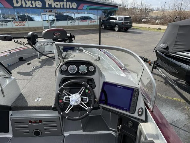 Slide: The Image of 2020 Ranger 621FS boat dashboard with steering wheel and navigation system at Dixie Marine. - 7