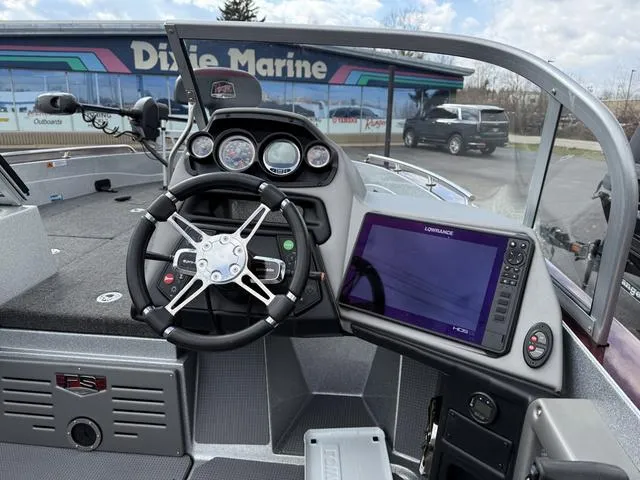 Slide: The Image of 2020 Ranger 621FS boat dashboard with steering wheel and navigation display. - 8