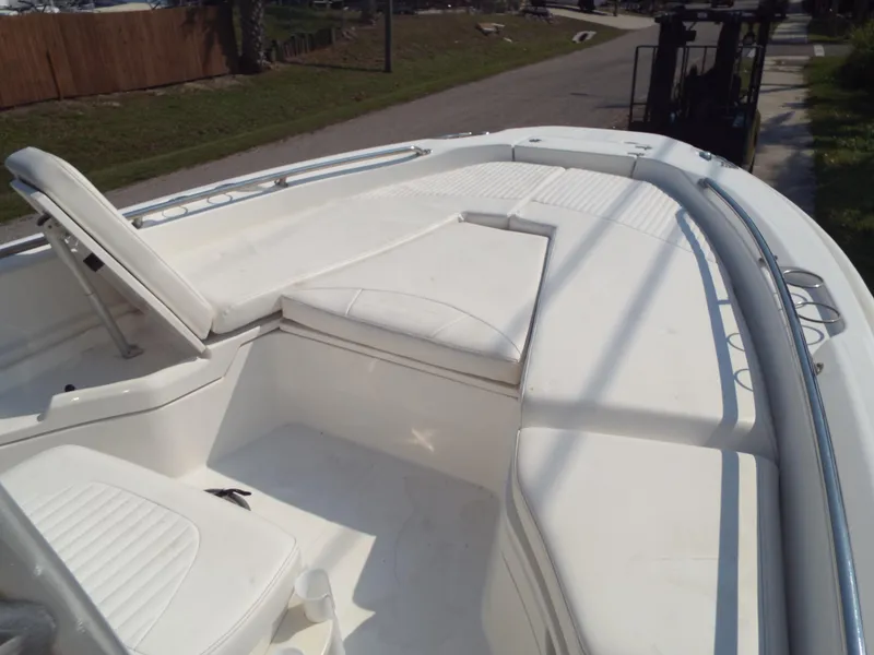Slide: The Image of 2013 Boston Whaler 230 Dauntless boat interior with white seating and deck. - 3