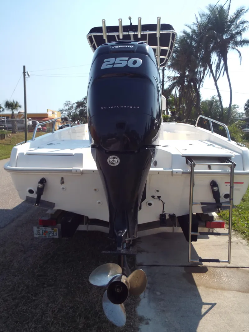 Slide: The Image of 2013 Boston Whaler 230 Dauntless boat with powerful Verado 250 engine, rear view. - 9