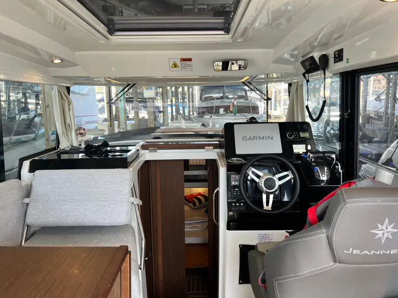 Slide: The Image of Interior of 2022 Jeanneau NC 895 Sport boat with Garmin navigation system. - 13