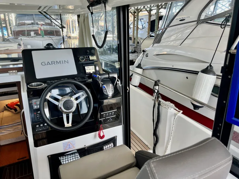 Slide: The Image of Interior view of 2022 Jeanneau NC 895 Sport boat with Garmin navigation system. - 14