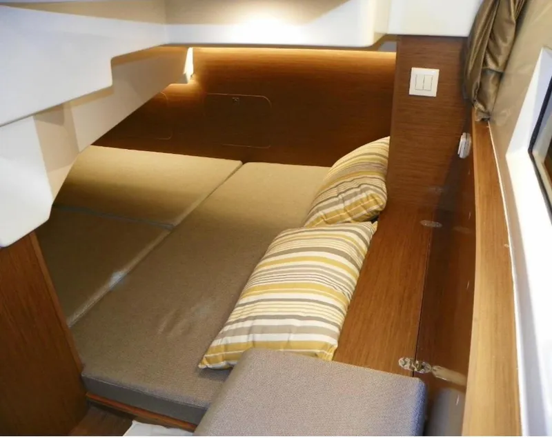 Slide: The Image of 2022 Jeanneau NC 895 Sport cabin interior with cozy bedding and modern design. - 20