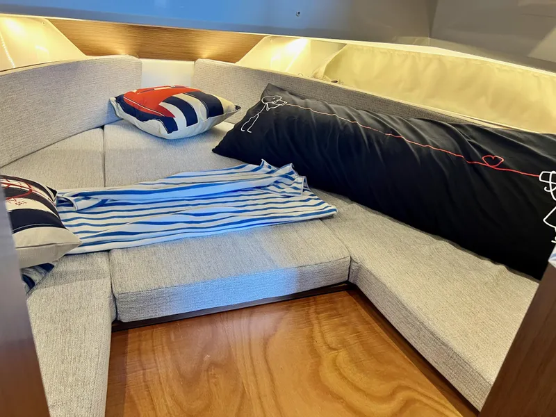 Slide: The Image of Cozy cabin interior of 2022 Jeanneau NC 895 Sport with stylish cushions and bedding. - 21
