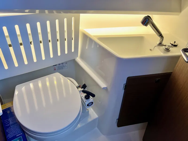 Slide: The Image of 2022 Jeanneau NC 895 Sport bathroom with modern sink and toilet design. - 23