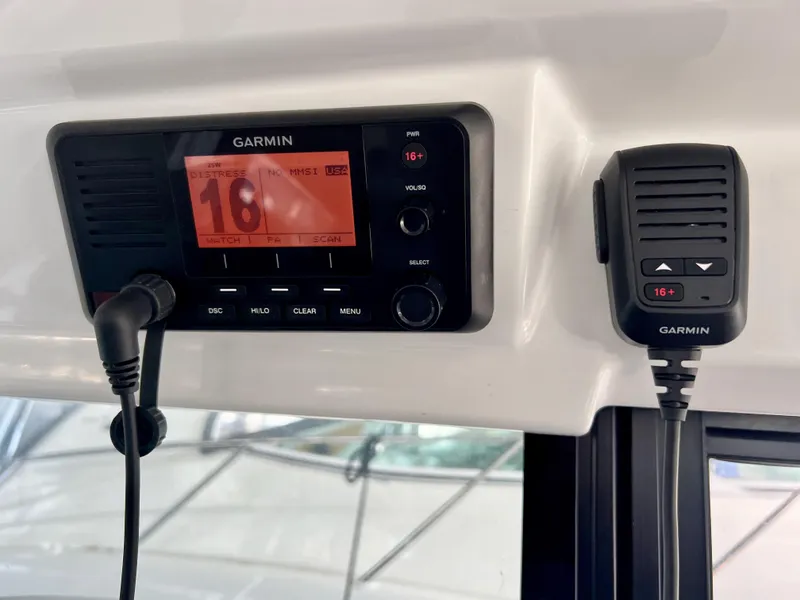 Slide: The Image of Garmin marine radio system on 2022 Jeanneau NC 895 Sport boat dashboard. - 26