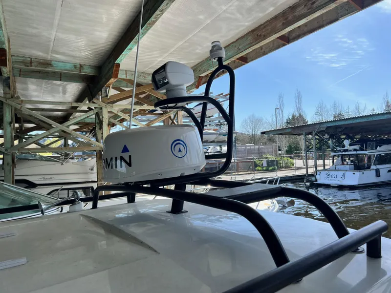 Slide: The Image of 2022 Jeanneau NC 895 Sport with Garmin radar under a covered dock. - 7
