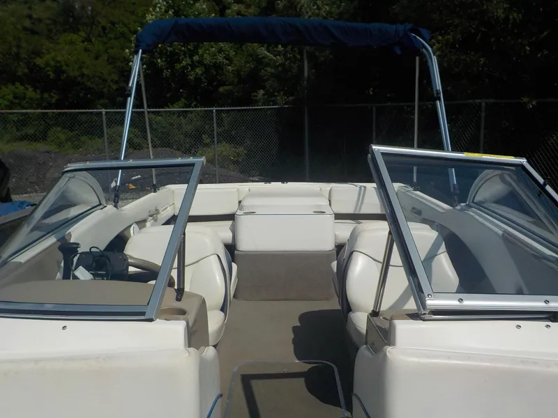 Slide: The Image of 2004 Bayliner International 195 Classic boat interior with seating and windshield. - 21
