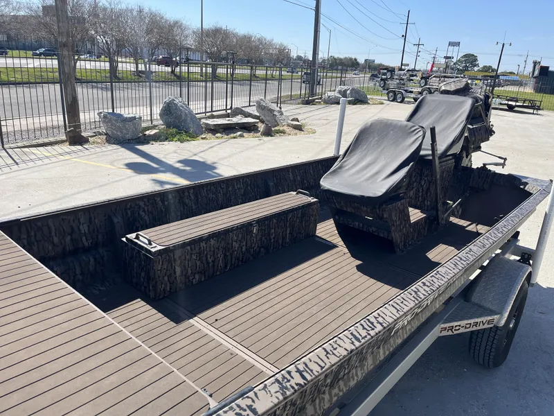 Slide: The Image of 2023 Pro-Drive SBX 1854 Stick Drive boat with camouflage seating and spacious deck. - 14