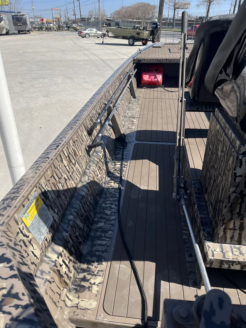 Slide: The Image of 2023 Pro-Drive SBX 1854 Stick Drive boat interior with camouflage design. - 4