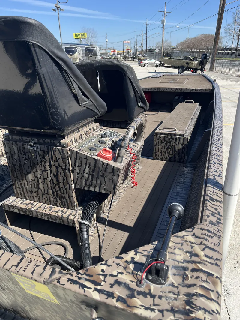 Slide: The Image of 2023 Pro-Drive SBX 1854 Stick Drive boat interior with camouflage design and seating. - 5