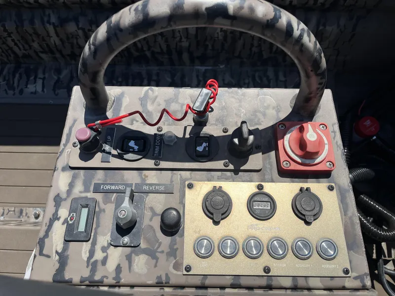 Slide: The Image of Control panel of 2023 Pro-Drive SBX 1854 Stick Drive boat with camouflage design. - 6