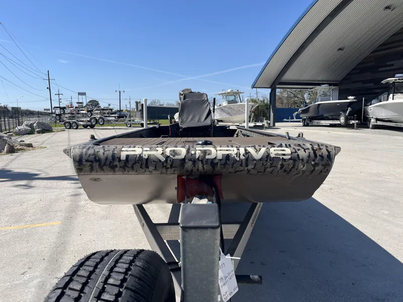 Slide: The Image of 2023 Pro-Drive SBX 1854 Stick Drive boat on trailer, outdoor showroom display. - 9