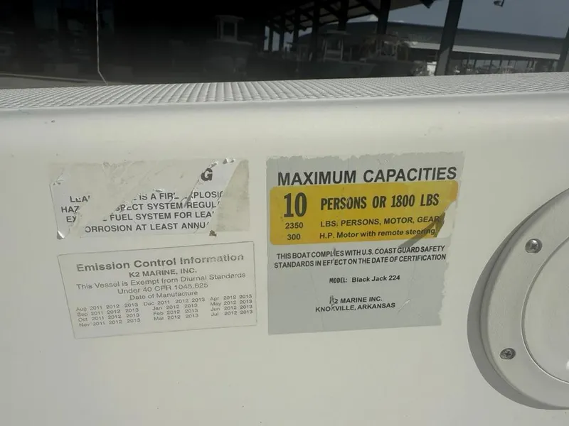 Slide: The Image of Boat capacity label for BlackJack 224, 2013 model, showing maximum 10 persons or 1800 lbs. - 3