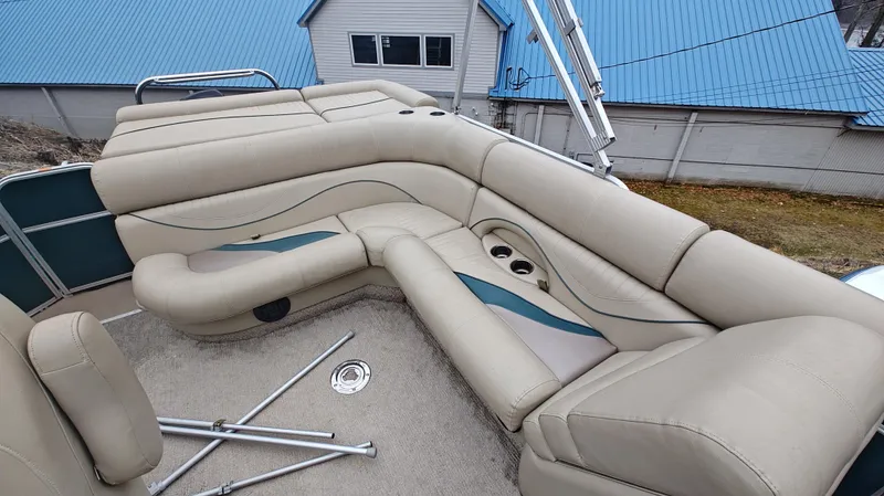 Slide: The Image of Luxurious seating on a 2012 South Bay 722CR pontoon boat with beige upholstery. - 10
