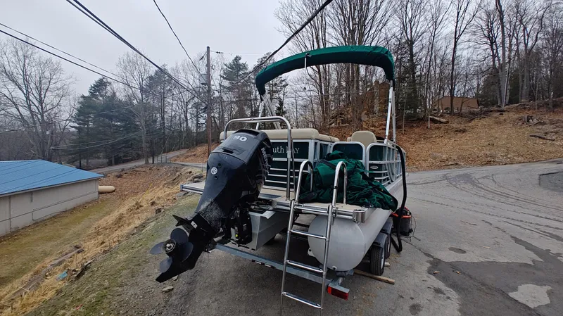 Slide: The Image of 2012 South Bay 722CR pontoon boat with outboard motor on a trailer. - 4